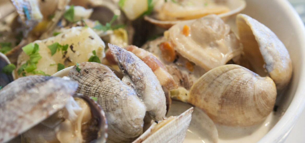 Extreme close up of a bowl of creamy clam chowder at Hog Island Oyster Co. in San Francisco