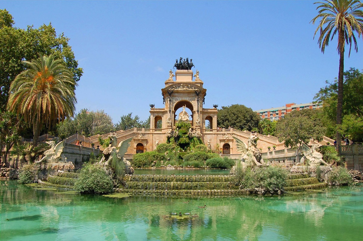 Ornate fountain surrounded by water on a warm spring day in Barcelona's Parc de la Ciutadella