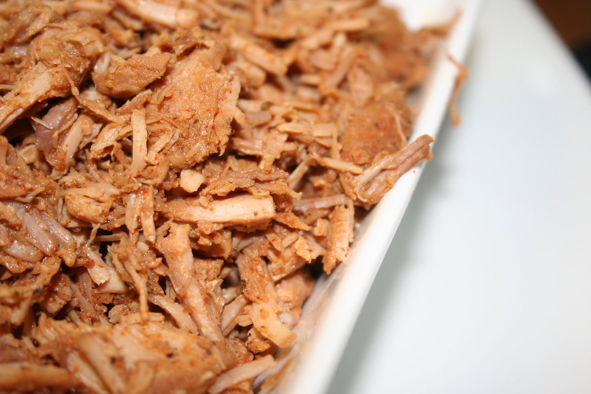 extreme close up of carnitas, slow roasted pork