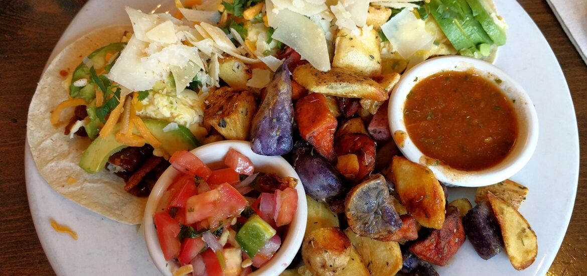 Plate of Morning tacos with chicken mango sausage and pico de gallo at Sweet Maple