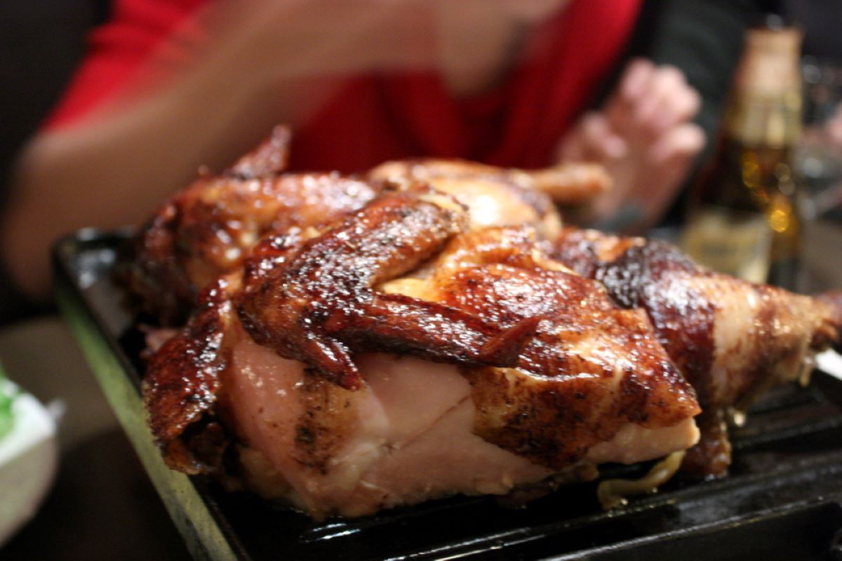 Freshly cooked pollo a la brasa on a grill. 