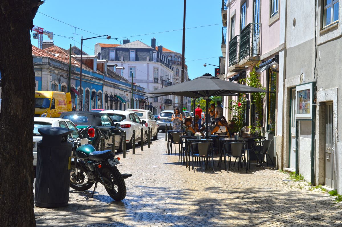 street with a restaurant and people eating