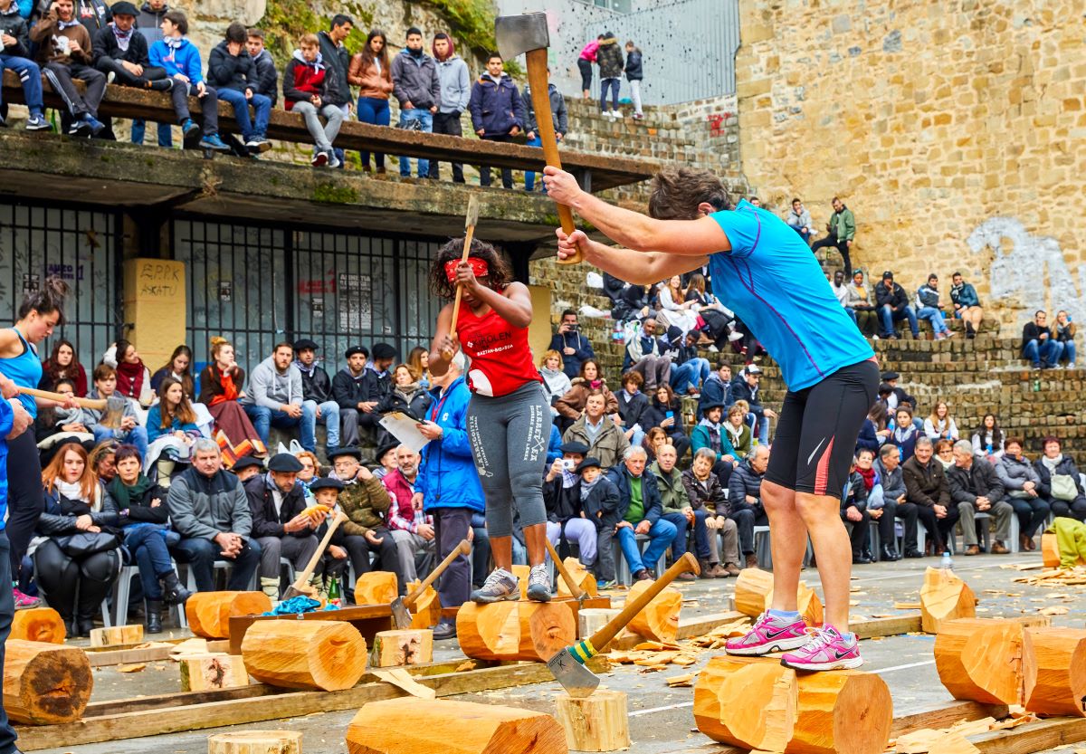 Competitors at a wood chopping competition at Euskal Jaiak. 