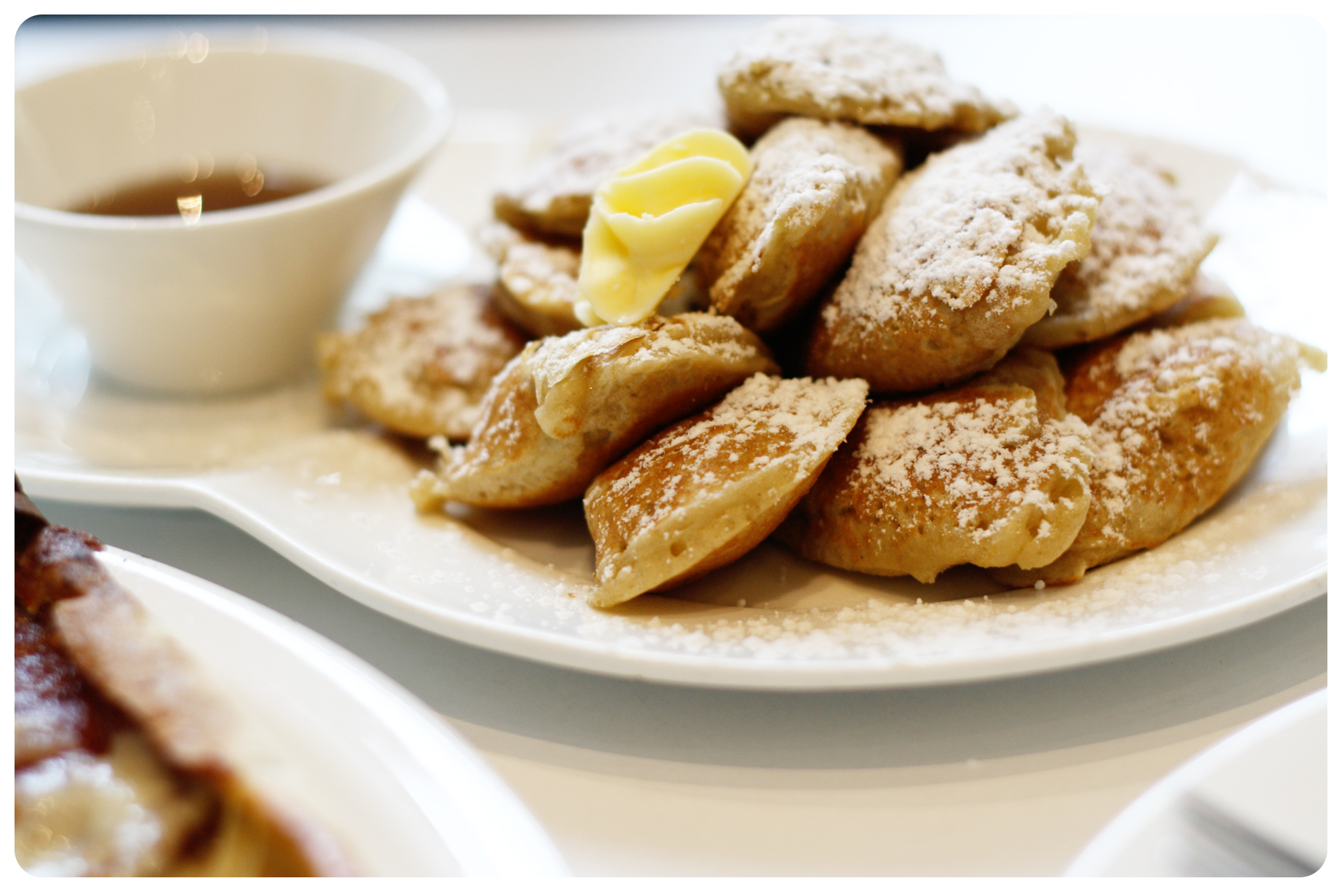 Poffertjes on a plate served with butter