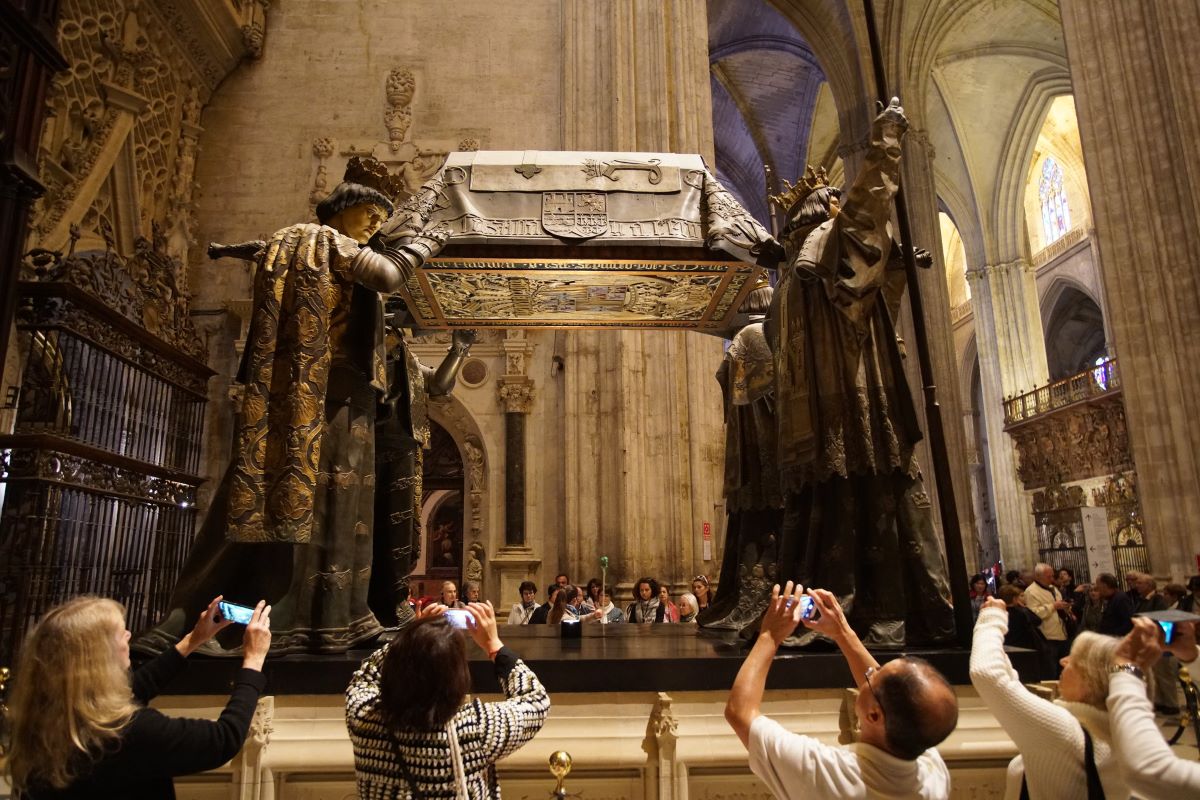 People visiting the Seville cathedral, taking photos of Christopher Columbus’ Tomb.