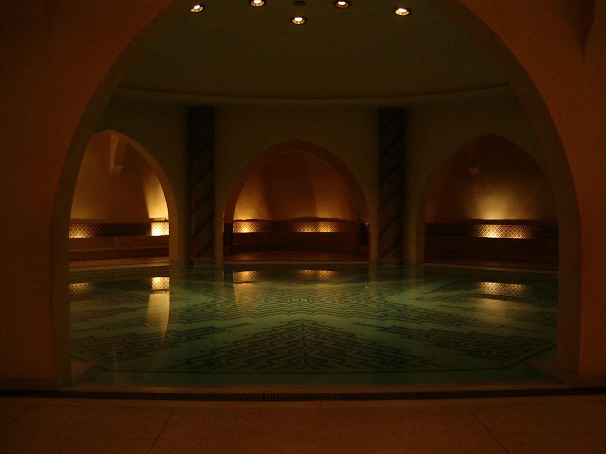 An Arab-style bathhouse with aqua blue water. 