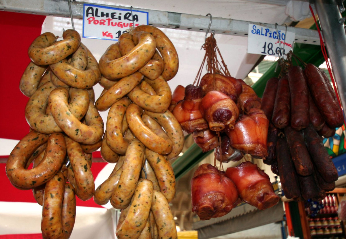 Portuguese sausages hanging in a market