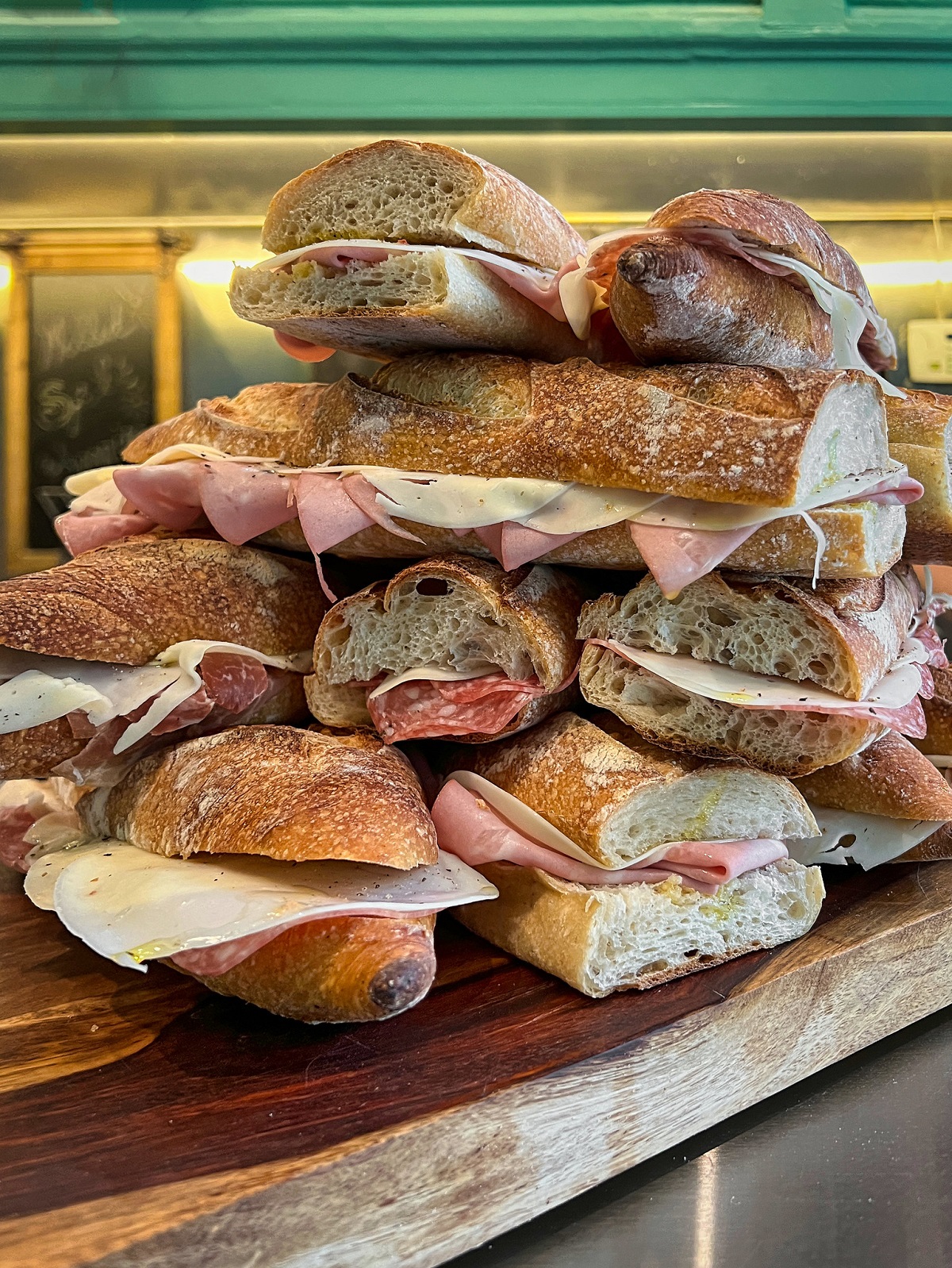 A stack of mortadella and cheese sandwiches