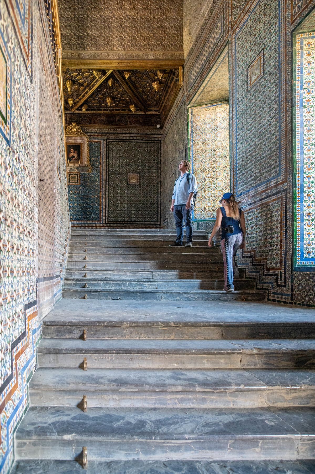 People exploring Casa de Pilatos looking for where to cool off in Seville. 