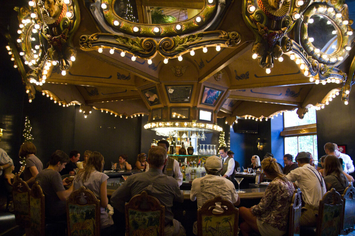 people seating around a carousel bar