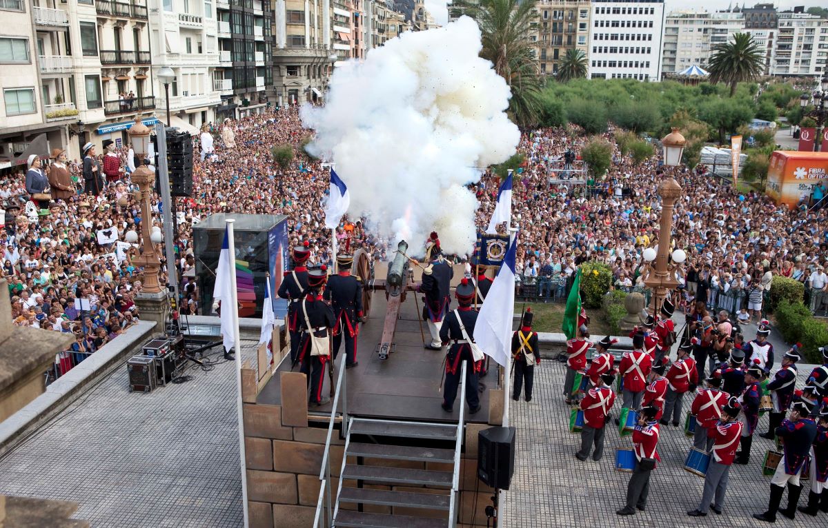 People on a stage firing a canon at Semana Grande in San Sebastian. 