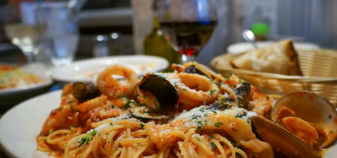 Close up of a plate of frutti di mare, a spaghetti dish with clams and seafood, a Giacomo's in Boston