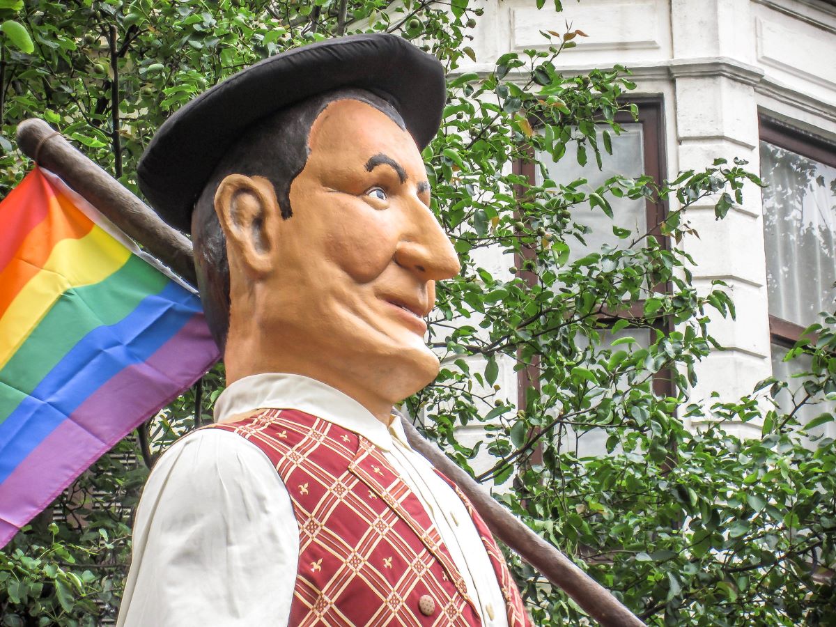 A giant puppet holding a rainbow flag at Semana Grande in San Sebastian. 