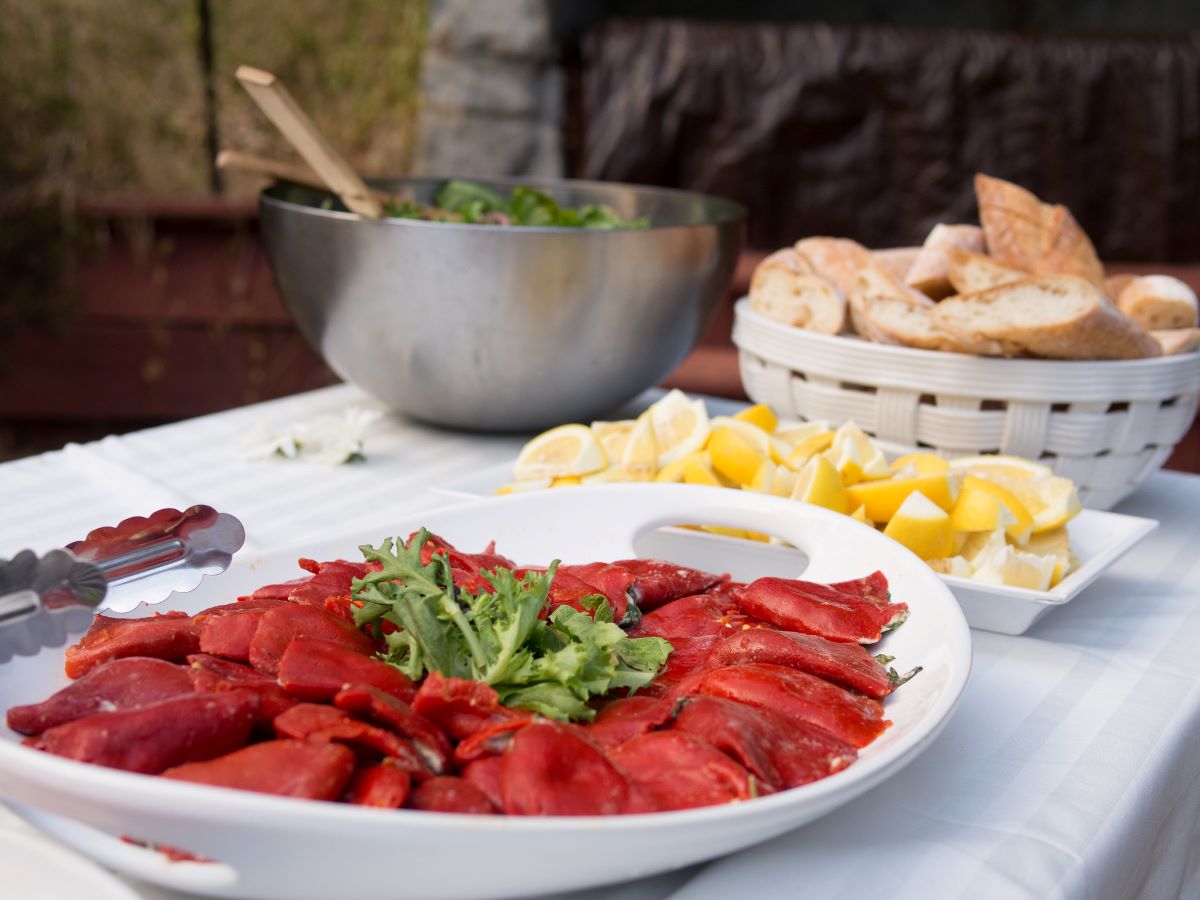 Stuffed Spanish piquillo peppers on a ceramic plate. 