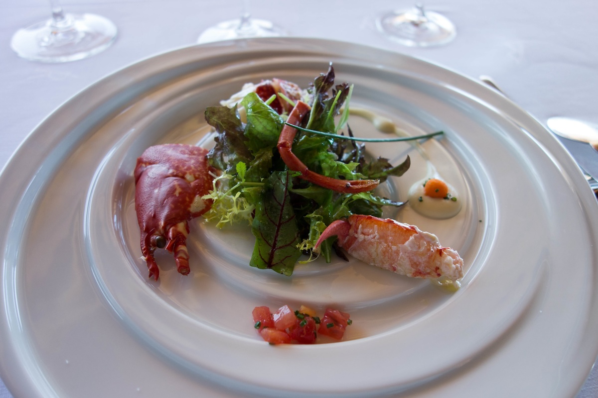 seafood on a plate with salad in michelin restaurant