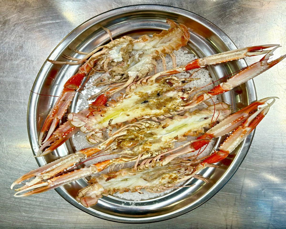 silver plate tipped with sauteed prawns