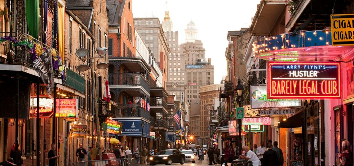 busy New Orleans street with neon lights