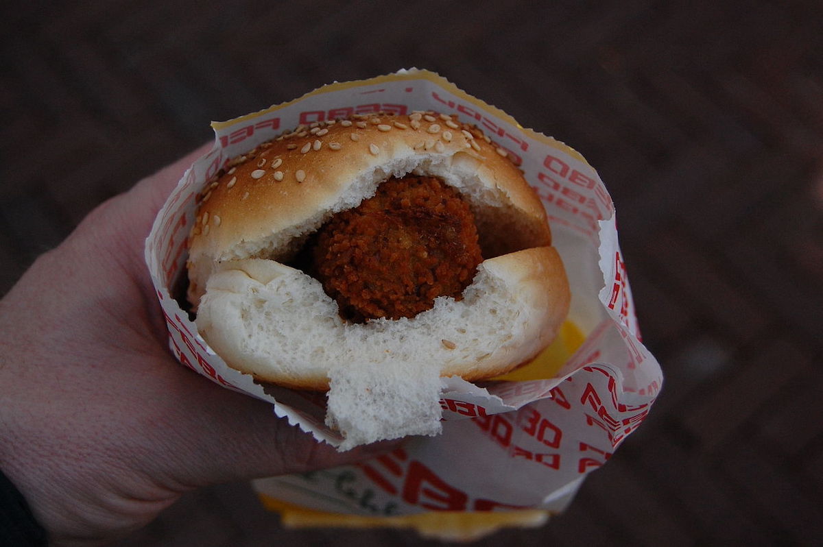 broodje kroket, a crispy veal croquette with mustard on a fluffy white bun. 