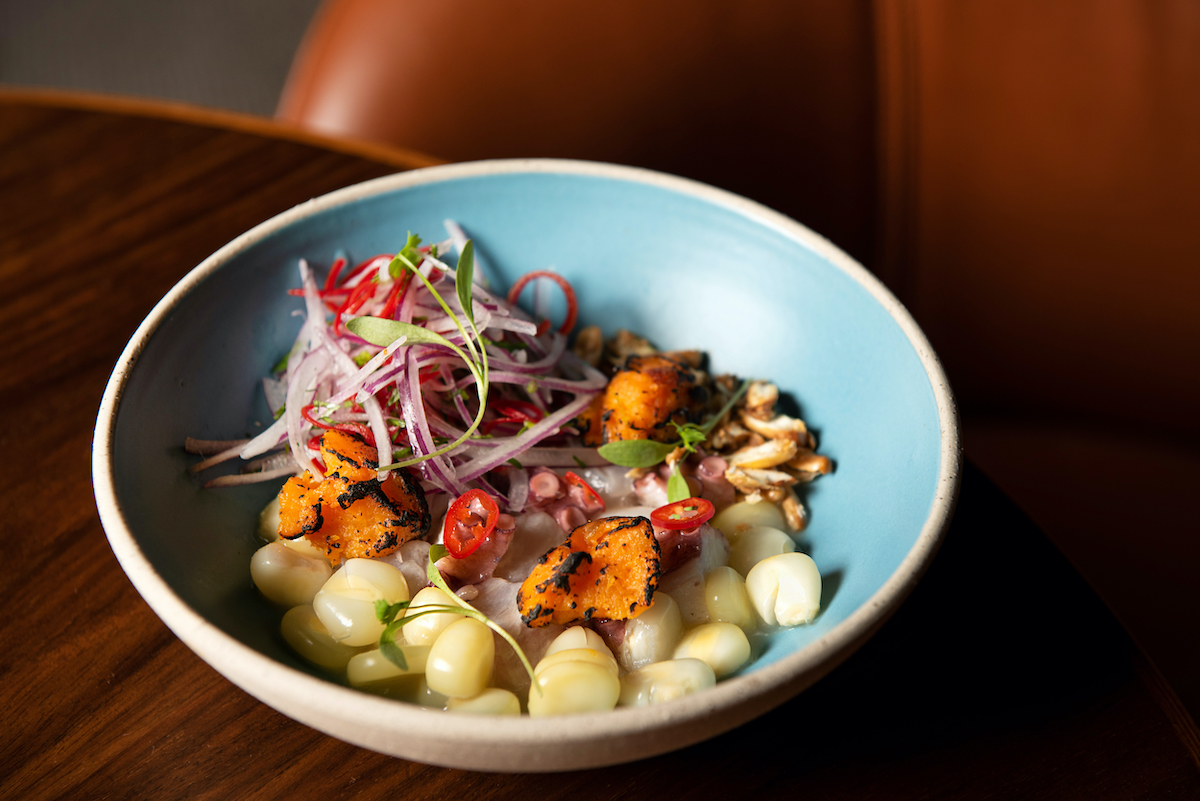 Ceviche in a pale blue bowl