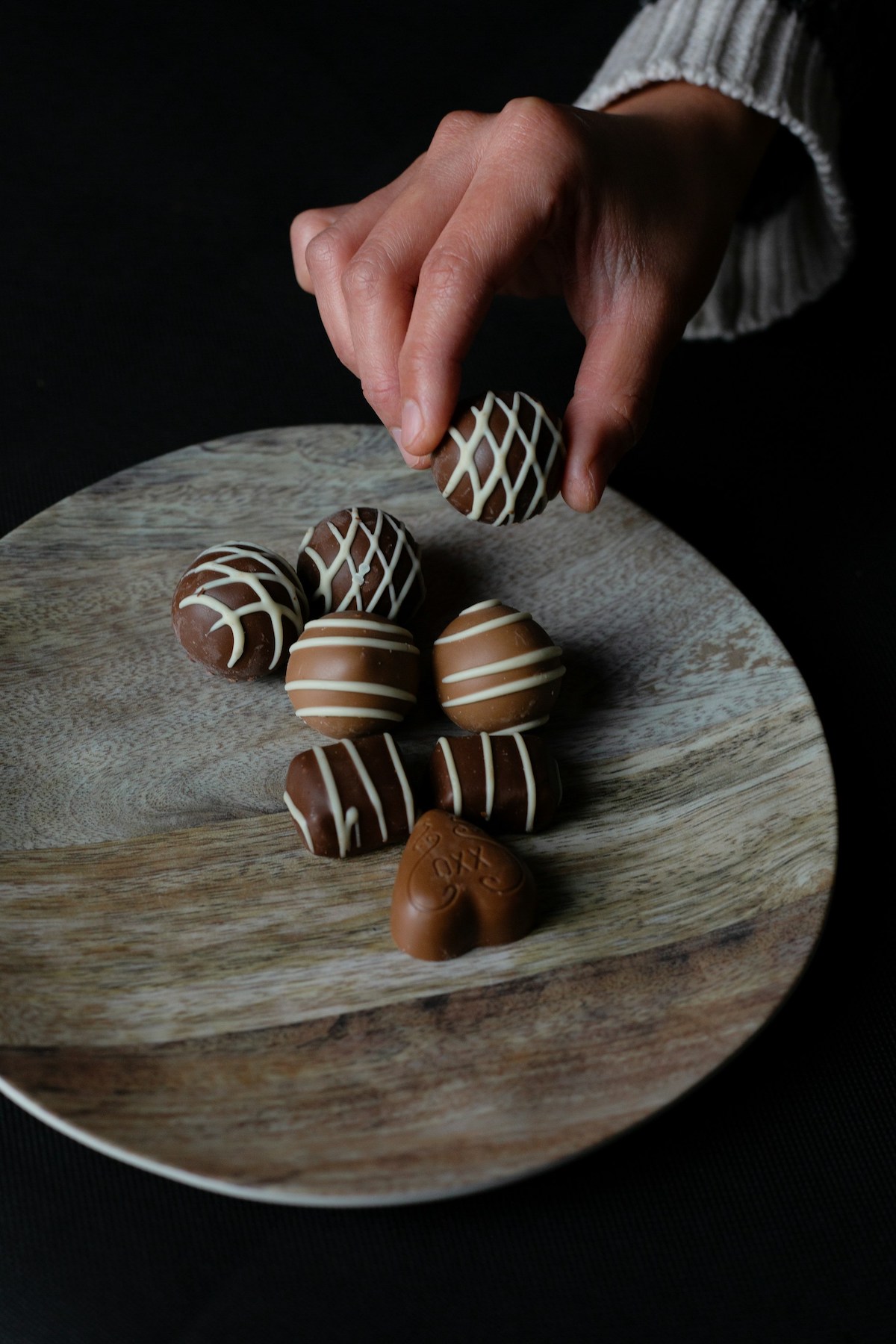 Hand picking the best chocolate in Paris