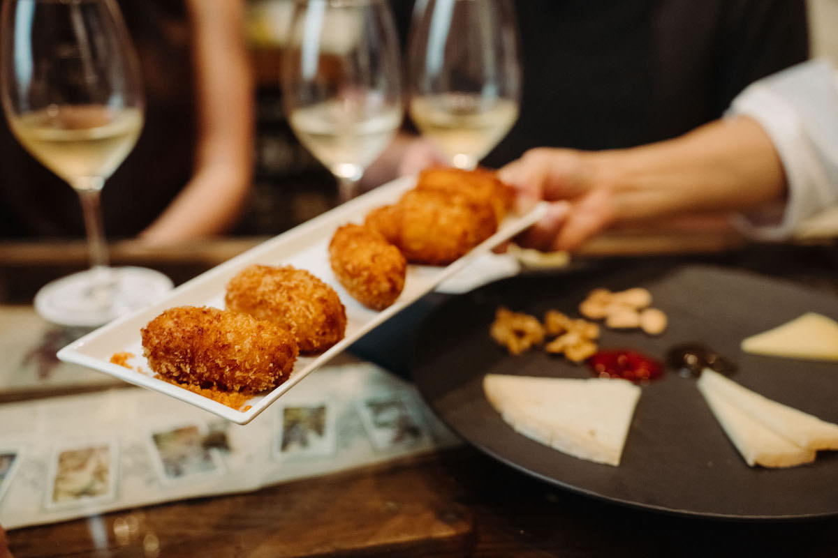 Croquetas and cheese with white wines, tapas and wine