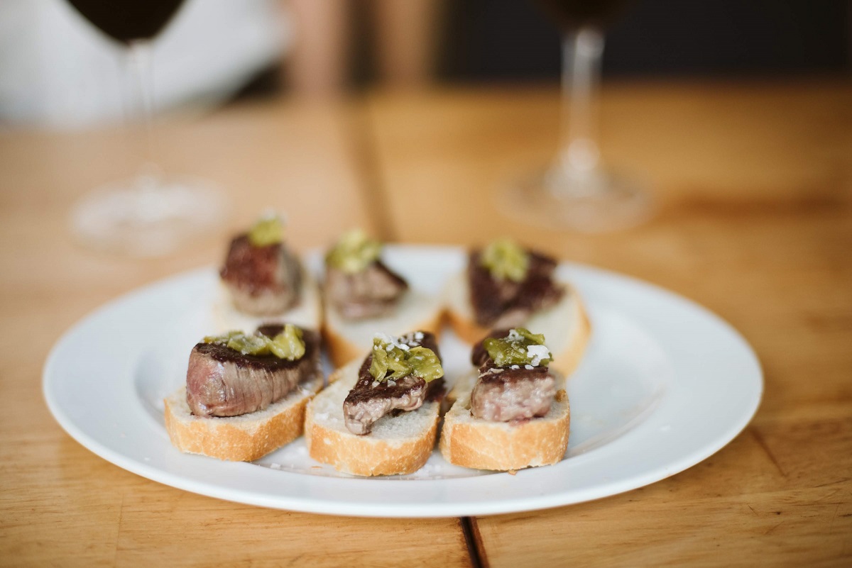 Plate of 6 pieces of toast with grilled sirloin steak (solomillo) at a pintxo bar in San Sebastian