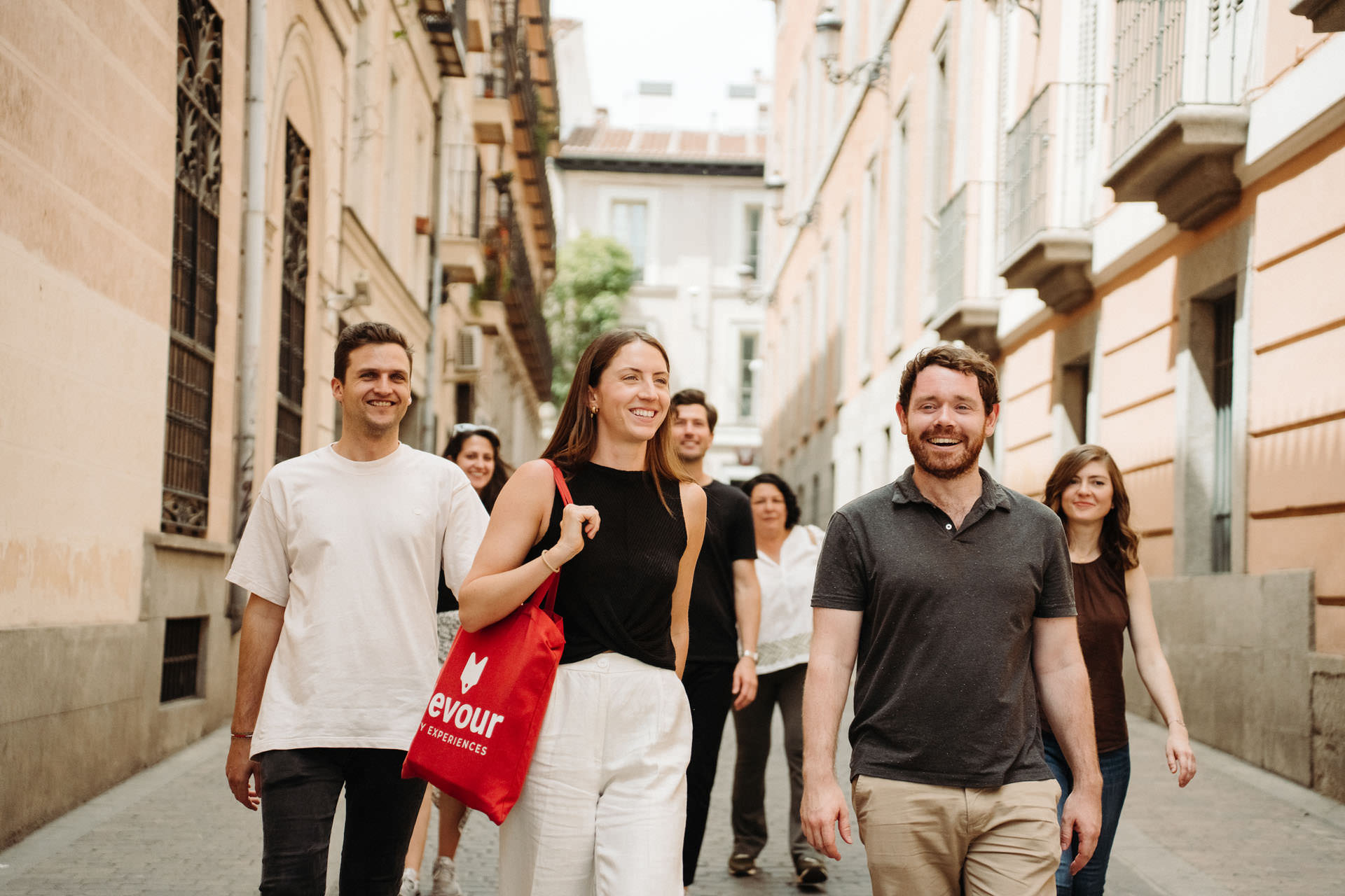 Group of people walking on a street in Madrid.