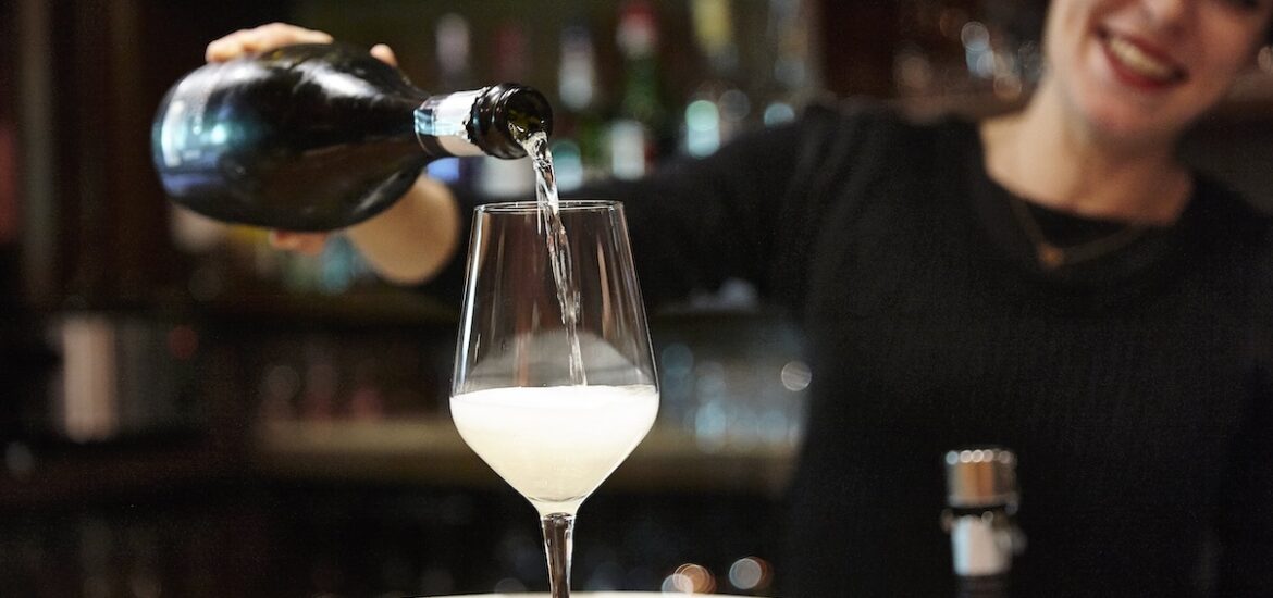 wine being poured into a glass