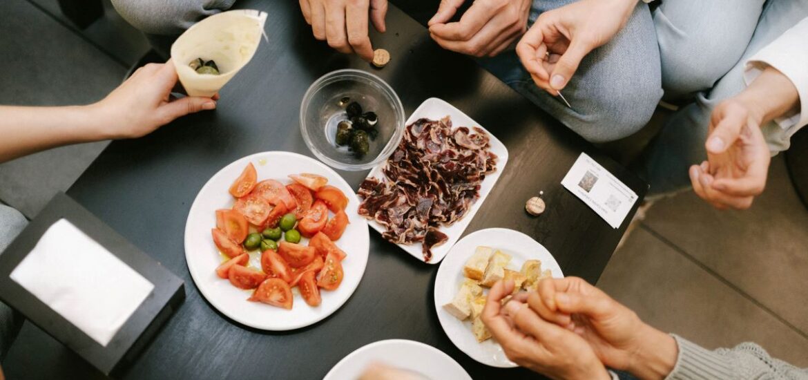 People trying different Basque dishes in San Sebastian.