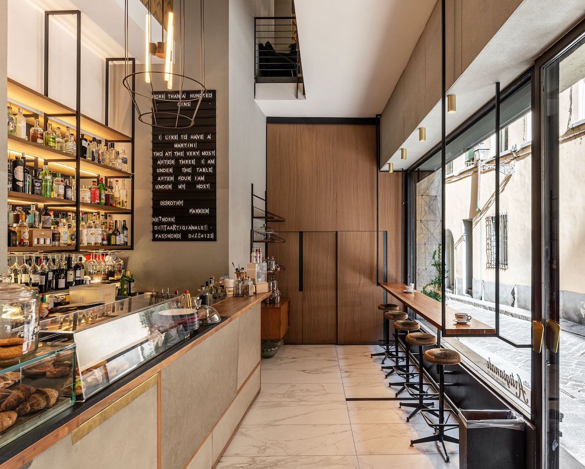 Interior of a cafe-bar in Florence in neutral colors with window seating