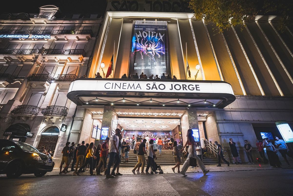 People walking outside of Cinema São Jorge getting ready to enjoy a film festival in Lisbon in September. 