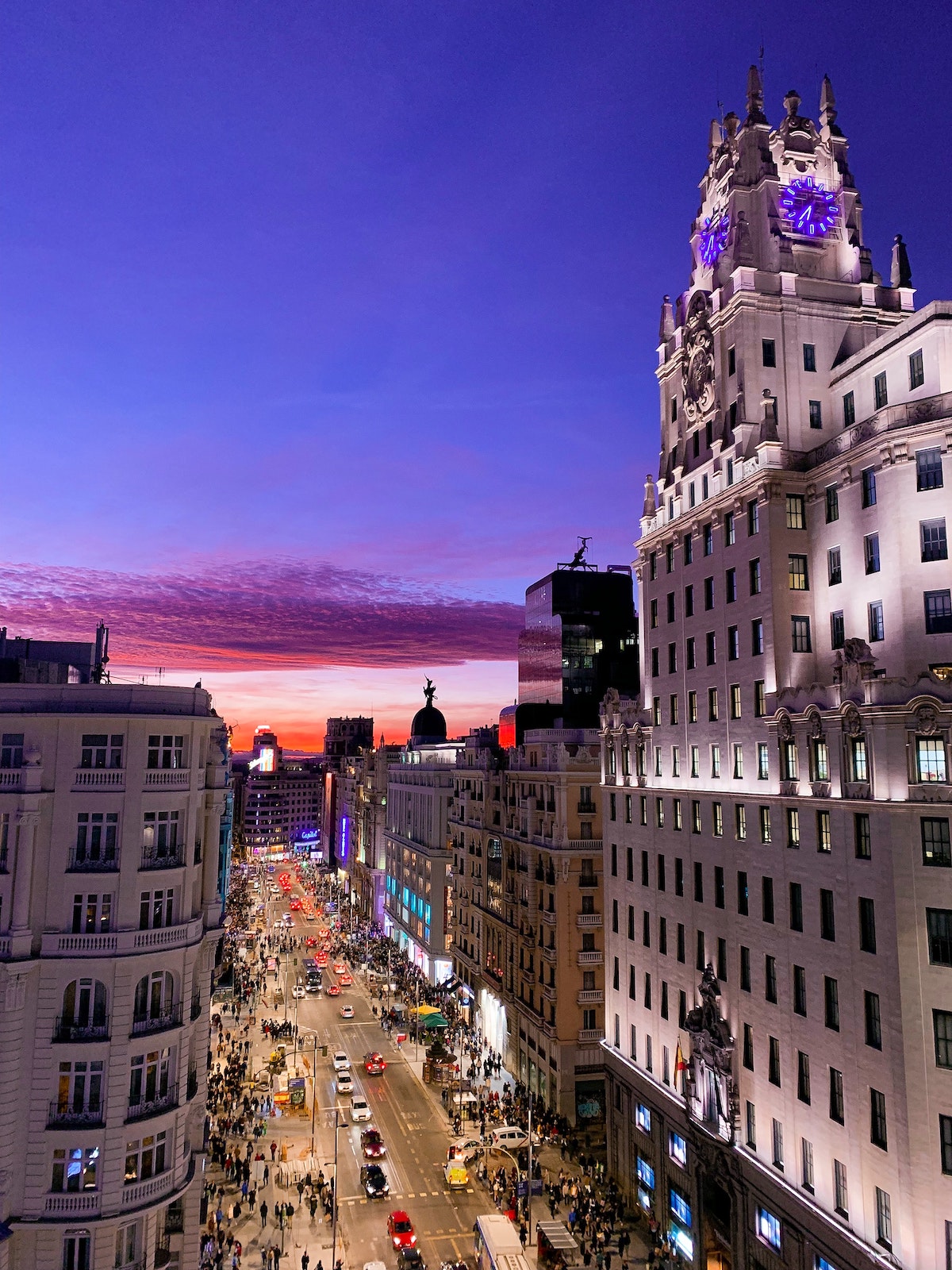 Nighttime view of a busy city street as seen from above