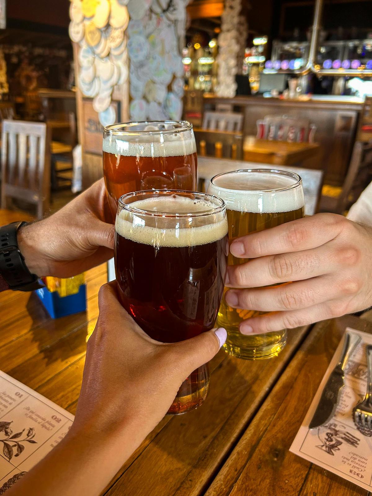 People drinking craft beers with friends in Amsterdam.