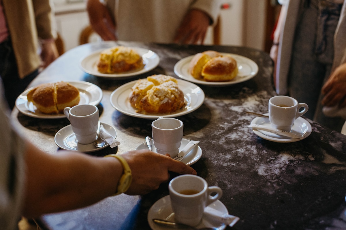 espresso cups and pastries on a table