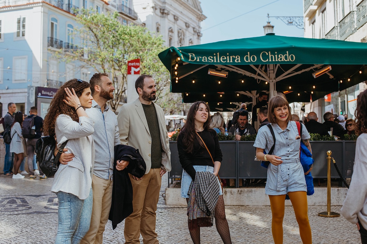 group of people in front of restaurant terrace