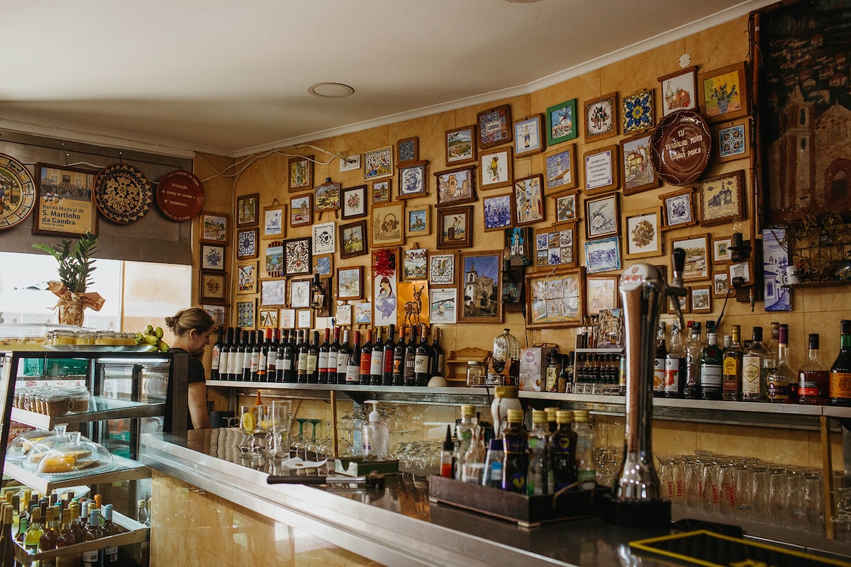 tavern bar with wall covered in picture frames