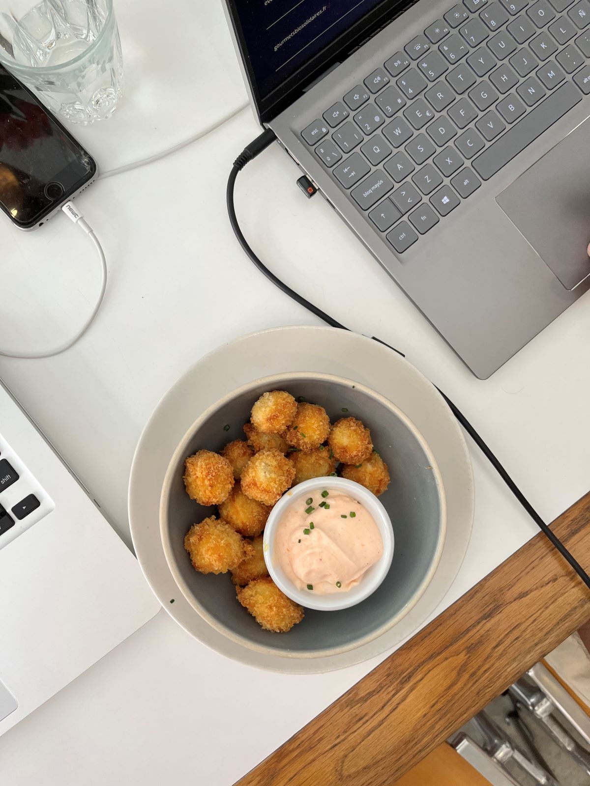 laptops in a cafe working with snacks