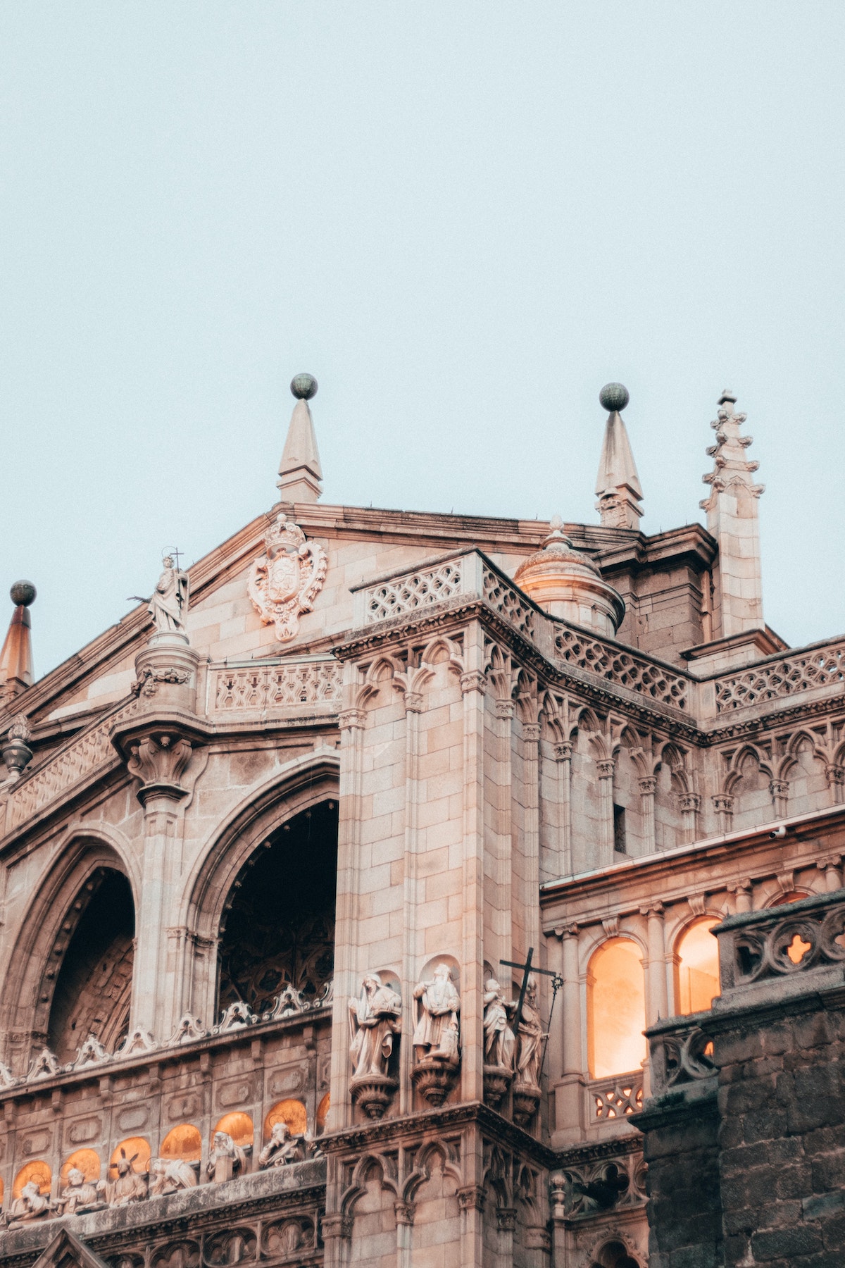 Close up view of the architectural detailing on a large stone church.