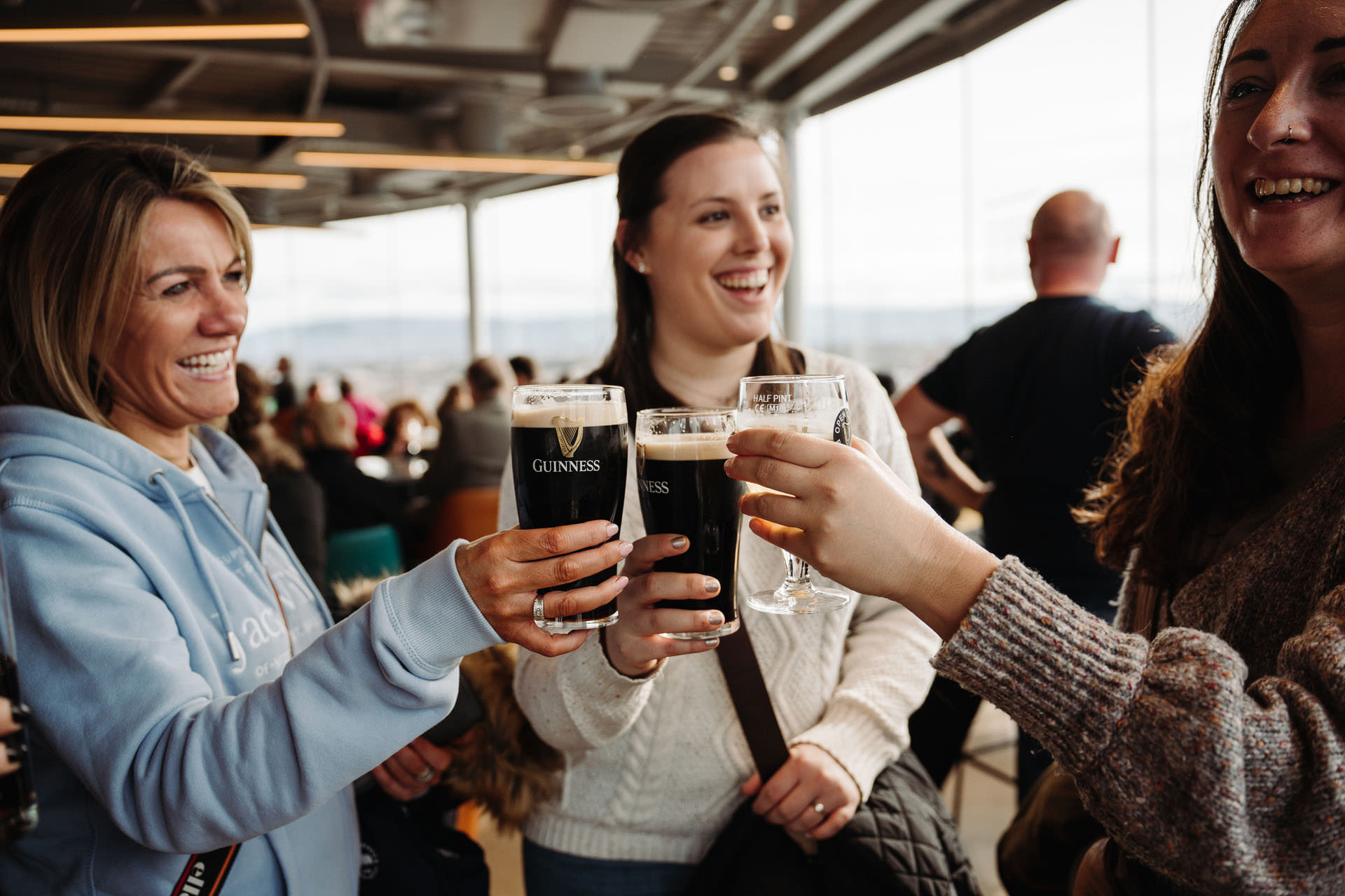 People toasting with a Guinness