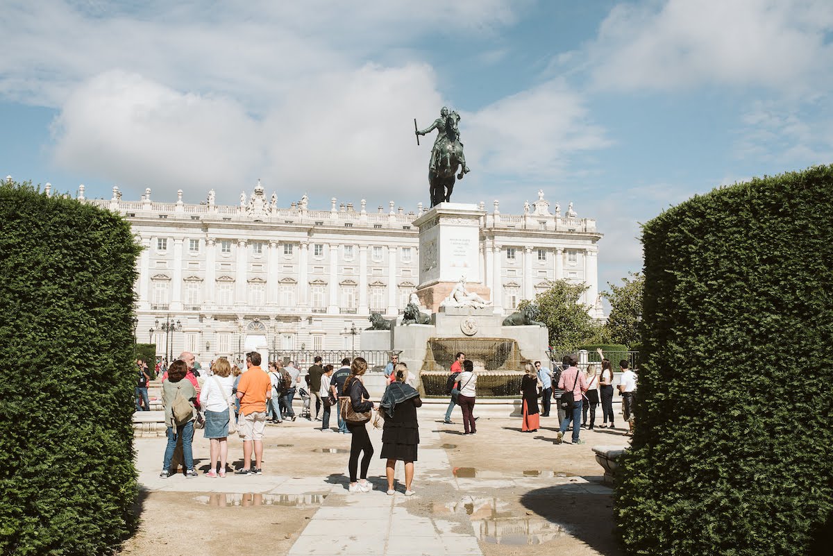 Large statue of a man on horseback in the middle of a public square.