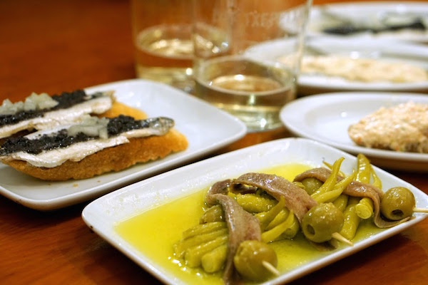 Drinking txakoli in San Sebastian is a must. We particularly love it alongside the tasty anchovies at Txepetxa!