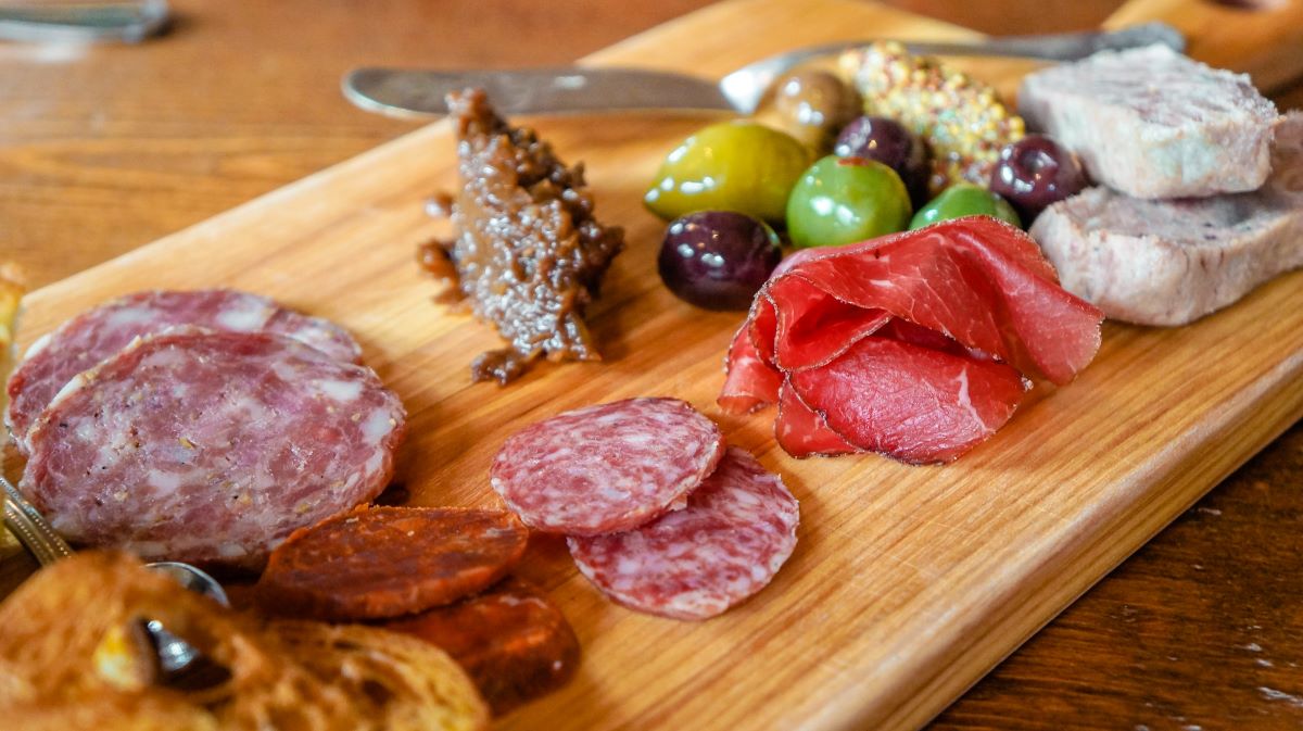 charcuterie board with various foods to sample