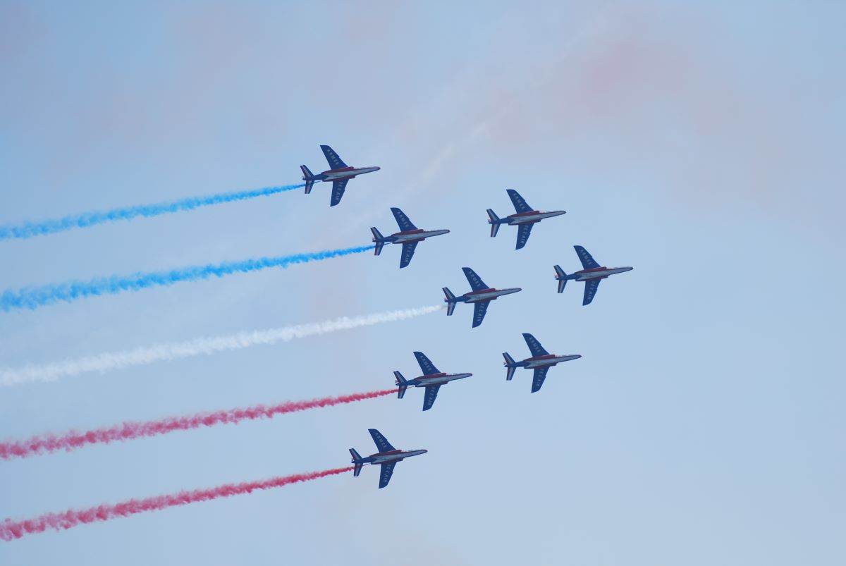 Air crafts in formation painting the sky with different colors for Festa al Cel in Barcelona in September. 