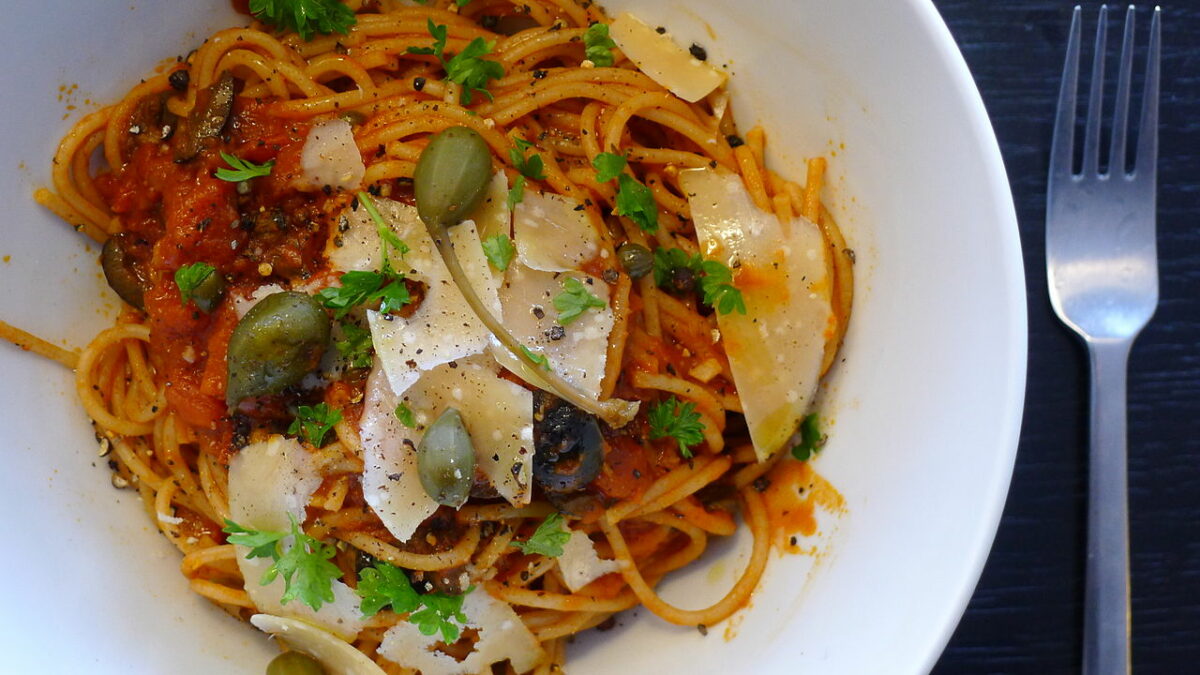 Spaghetti alla Puttanesca tomato sauce capers olives and cheese