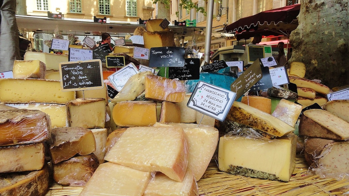 table filled with different french cheeses