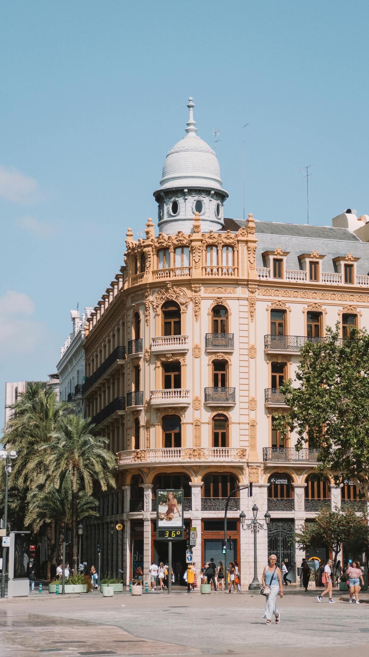 Person walking in a sunny Valencian street