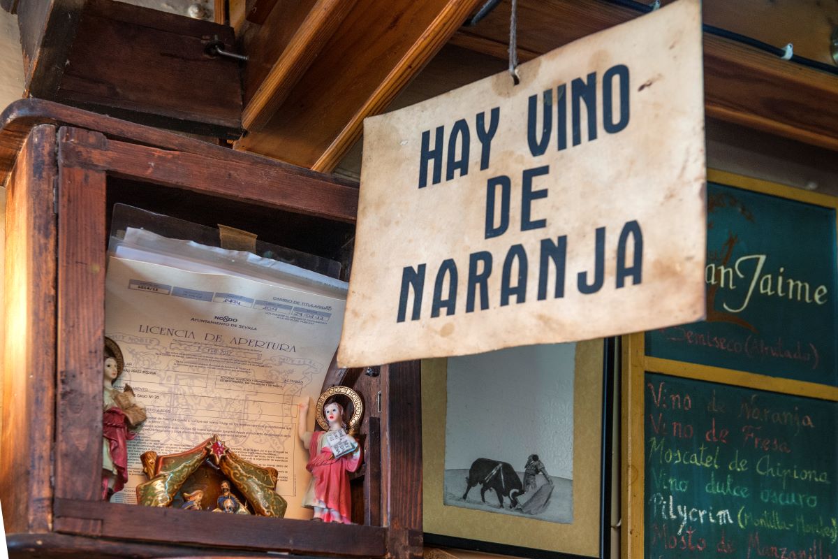 sign at at a bar offering orange wine