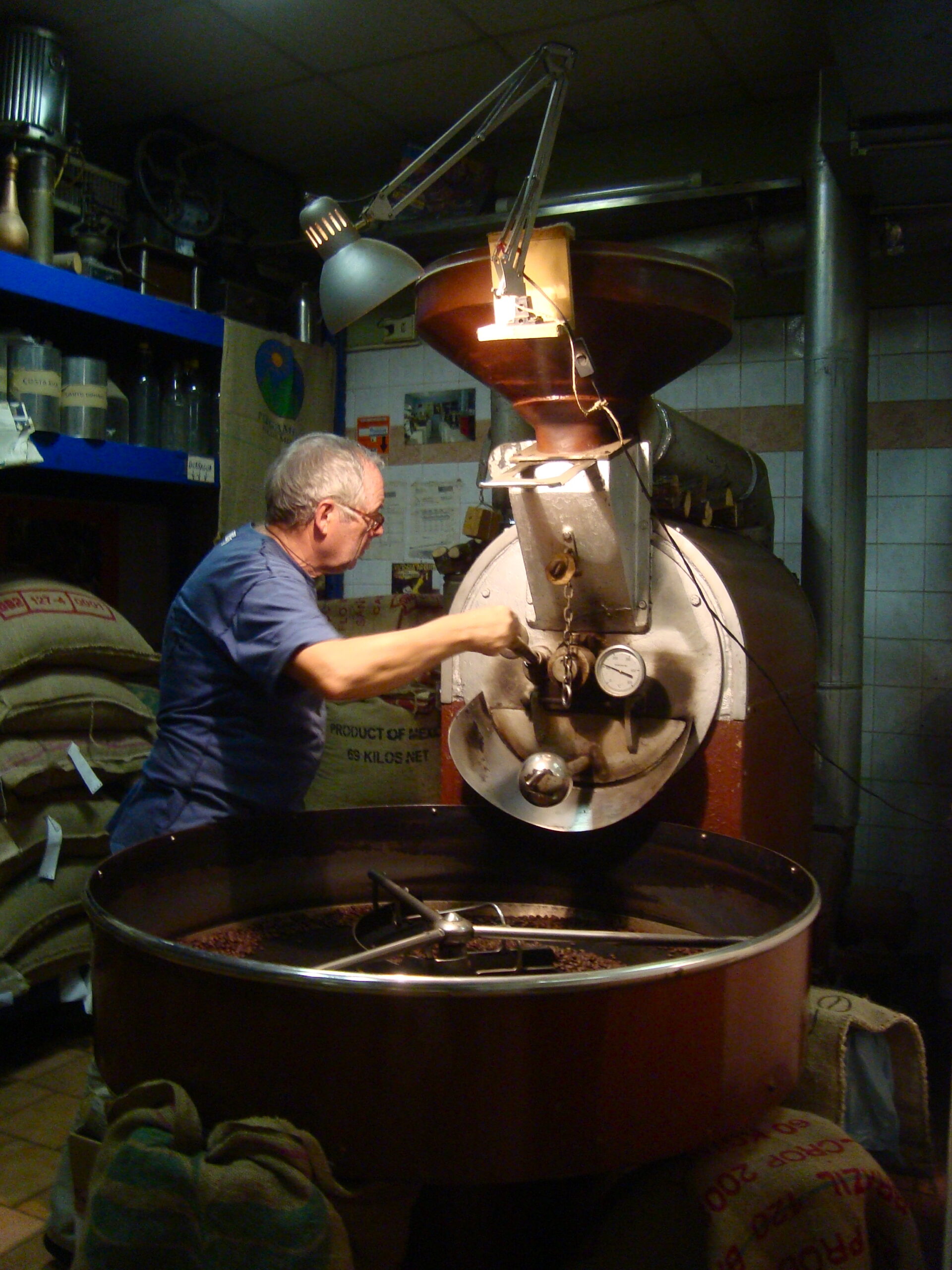 Coffee roaster at Sant’ Eustachio il Caffè toasting coffee beans