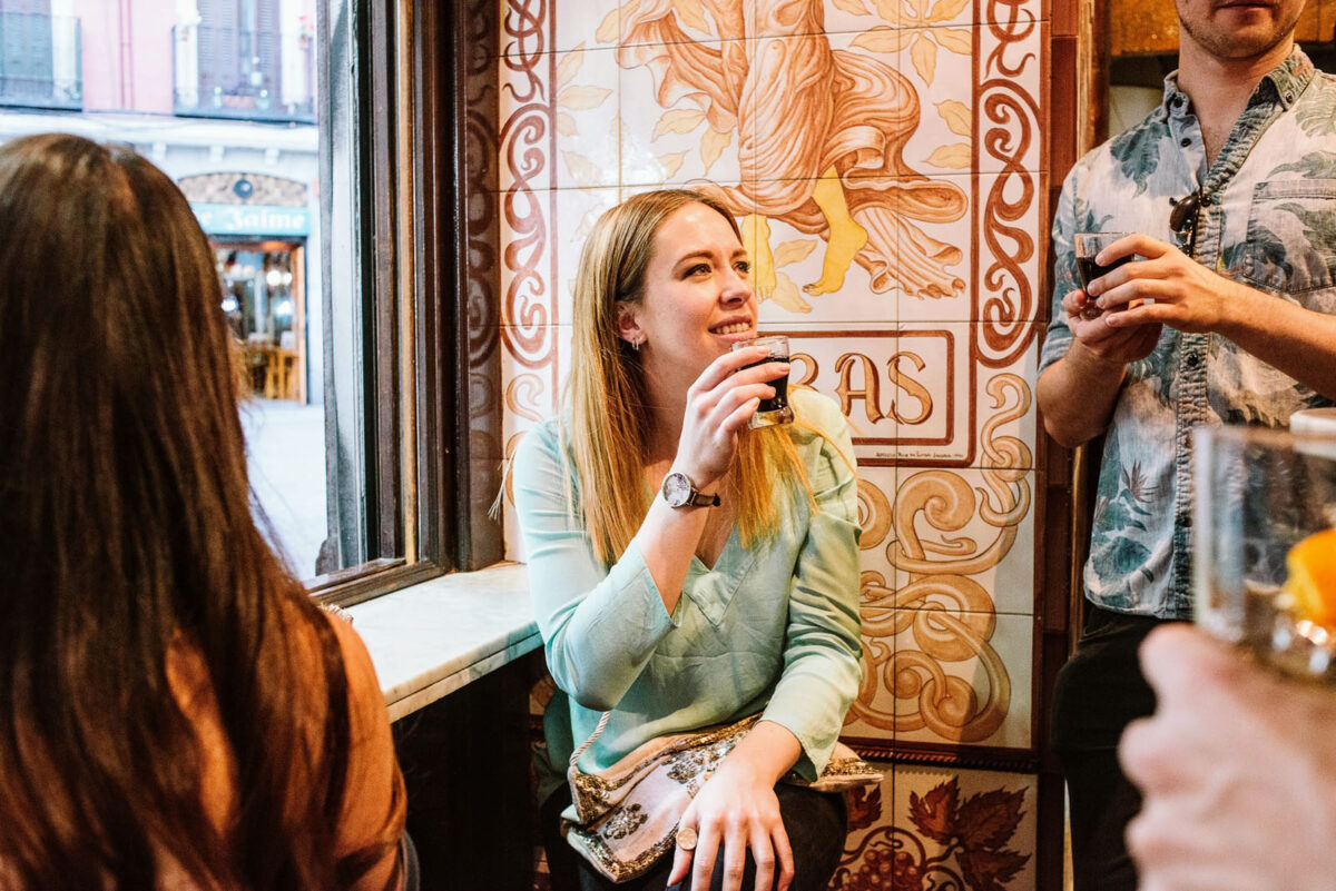 People in spring drinking at a bar in Madrid.