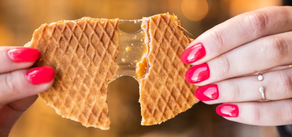 Stroopwafel being pulled apart showing the delicious inside